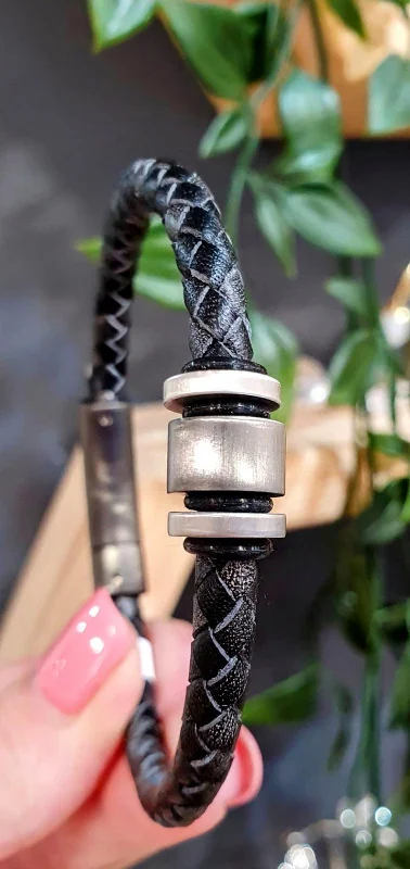 Unique & Co Black Leather Bracelet with a Gunmetal Charm